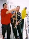 Simon King receiving some help from Celtic Wildcat Assistant Skipper Adam O'Sullivan with a nice haul of codling