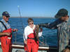 Sabre Tooth Skipper Phil Hambridge holding up a nice Codling caught by Claudia Page with husband Ron looking on proudly