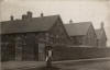 A very old picture of our school, complete with a pupil with her young brother or sister, taken probably around the 1920's
